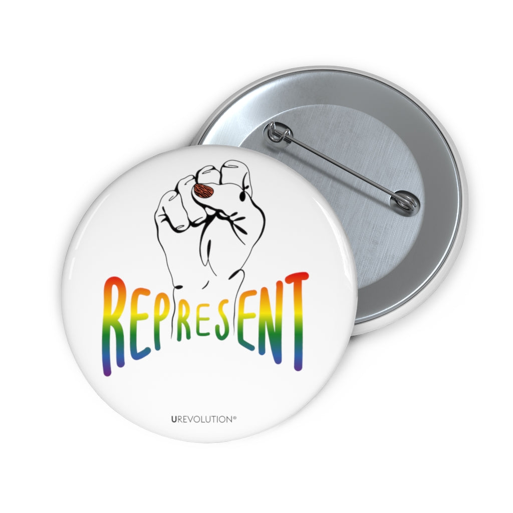 Represent Pride Pin Button. In the middle of the represent pride pinback button is a black line drawing of a raised clenched fist, with the handwritten word "represent," written in blended upper case rainbow pride colors: red, orange, yellow, green, indigo, and violet. Under the fist, at the bottom of the magnet, is the word URevolution in small black upper case letters.