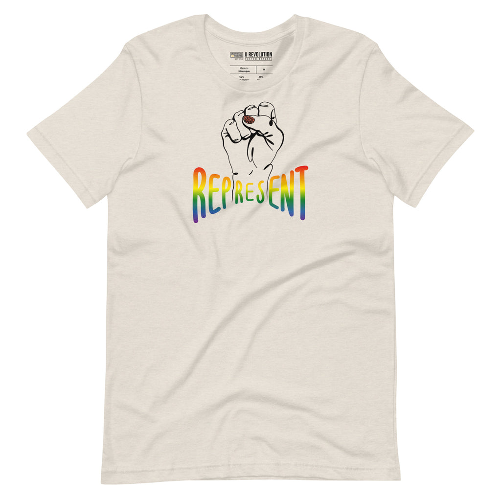Heather dust Represent Pride T-shirt. In the middle of the represent pride tee is a black line drawing of a raised clenched fist, with the handwritten word "represent," written in blended upper case rainbow pride colors: red, orange, yellow, green, indigo, and violet.