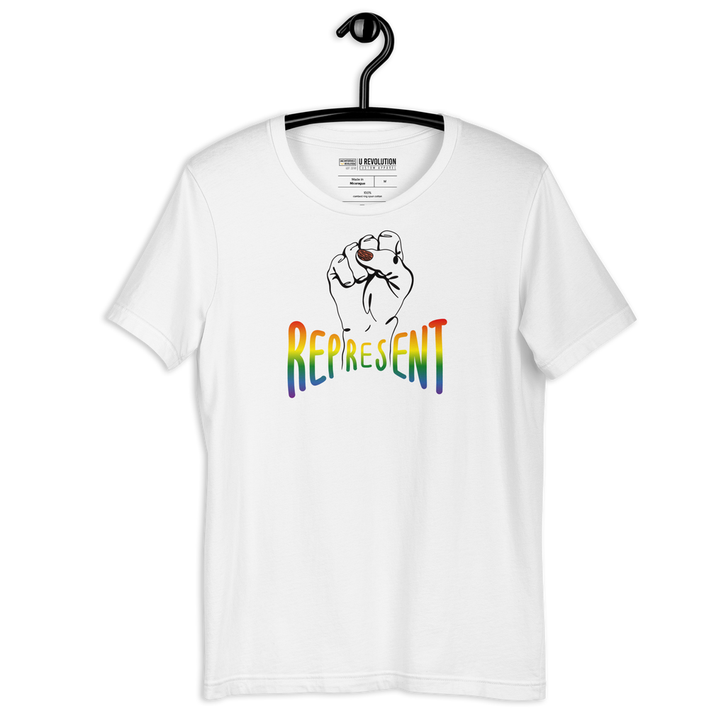 Photo of a white-color Represent Pride Tee. In the middle of the represent pride tee is a black line drawing of a raised clenched fist, with the handwritten word "represent," written in blended upper case rainbow pride colors:  red, orange, yellow, green, indigo, and violet. The tee is on black hanger.