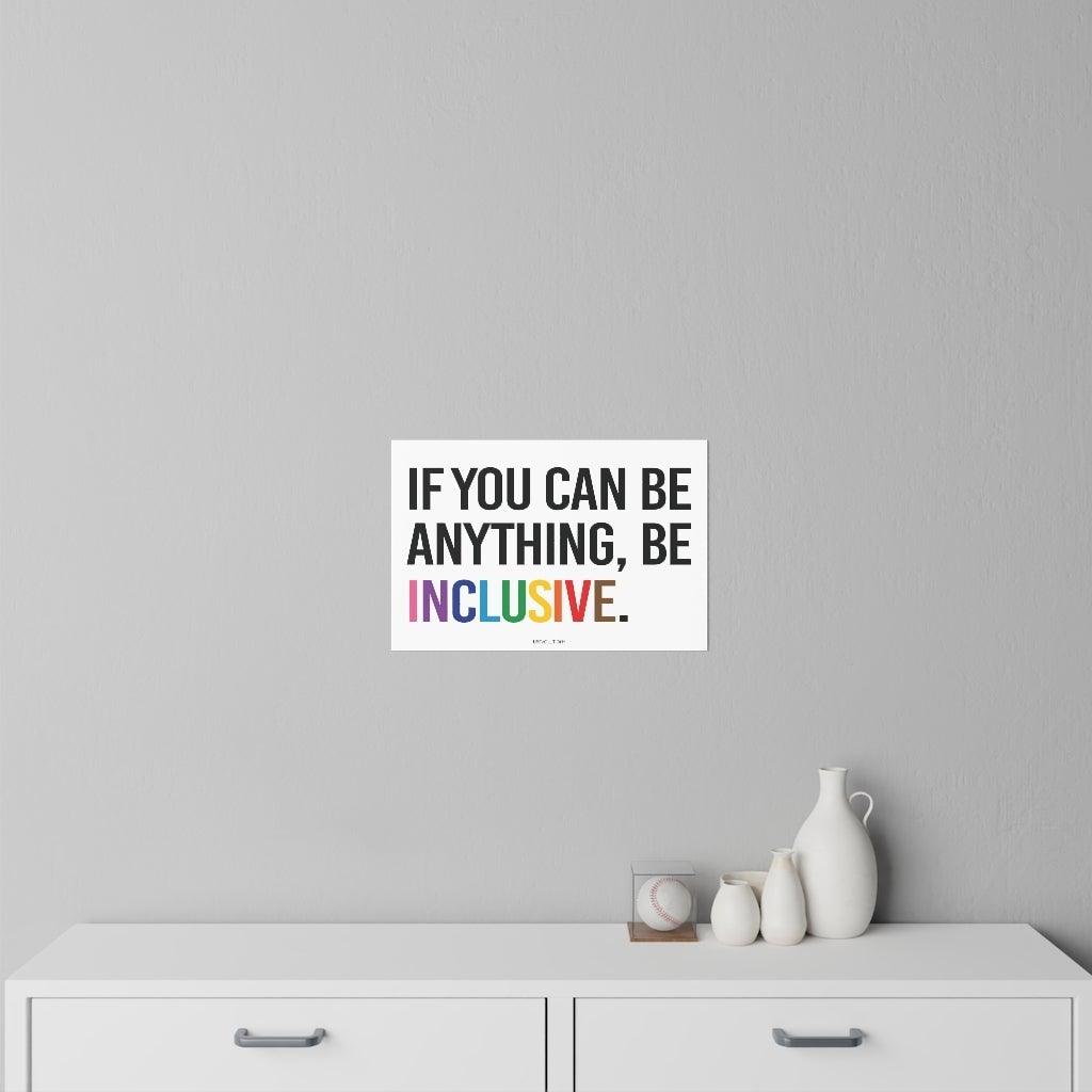 This is a photo of a Be Inclusive decal. In the middle of the wall decal, taking up 90% of the surface area is the quote in upper case letters: "If you can be anything, be inclusive." The words - be inclusive - are in the colors of the rainbow.The inclusive decal is placed on a gray wall above a set of draws.
