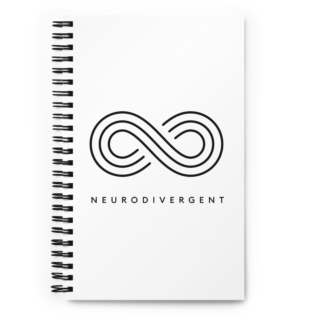This is a photo of a spiral white Neurodivergent notebook. In the middle of the white notebook is an elegant black infinity symbol consisting of three thin black lines. Just below the infinity symbol is the word Neurodivergent in elegant upper case black letters.