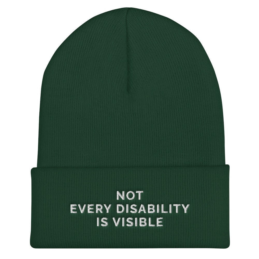 Beanie Inspo - a photo of a spruce-colored hypoallergenic Not Every Disability Is Visible Beanie lying flat against a plain background. On the cuff of the beanie the phrase, 'Not Every Disability Is Visible,' is embroidered on it over three lines in white upper case letters. 