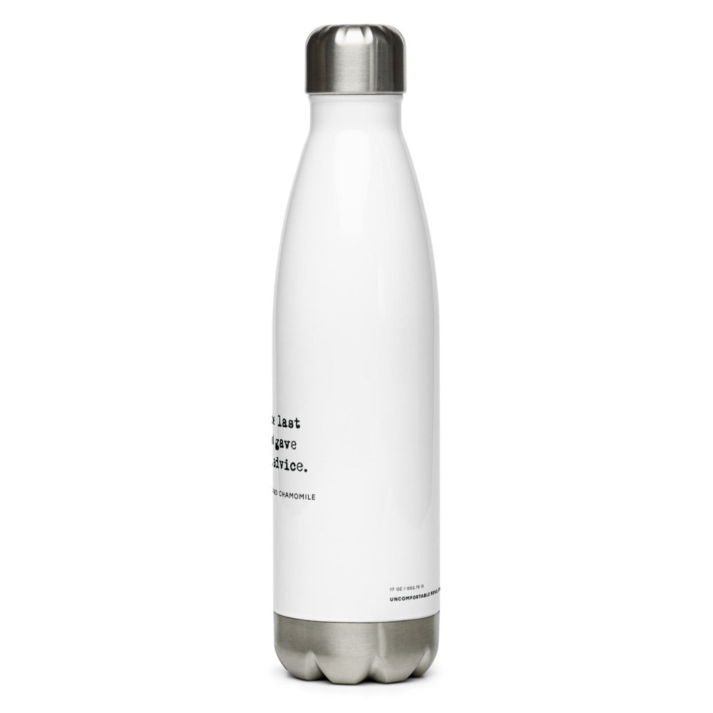 The no medical advice water bottle is white, shaped like a bowling pib, with black text that reads: "no. 57. Tears of the last person that gave me medical advice. With hints of lemon and chamomile." The bottle is shaped like a bowling pin. At the bottom of the bottle is the measurement 17 OZ and the words, Uncomfortable Revolution