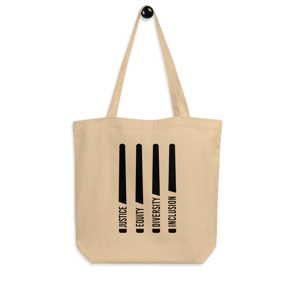 This is a natural Justice Equity Diversity Inclusion organic tote bag. Four black laser swords are placed vertically in the middle of the tote, similar to a flag. On the left-hand side of each sword, in the place of the handle, is one word: Justice Equity Diversity Inclusion.