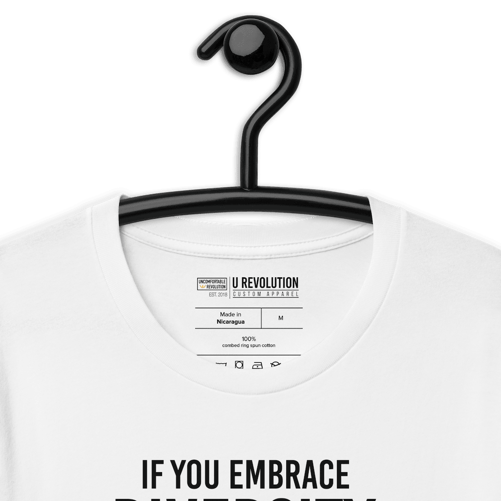 An image of a white Embrace Diversity T-Shirt. The t-shirt features the phrase, printed in white upper case letters, "If you embrace diversity but ignore disability, you're doing it wrong."