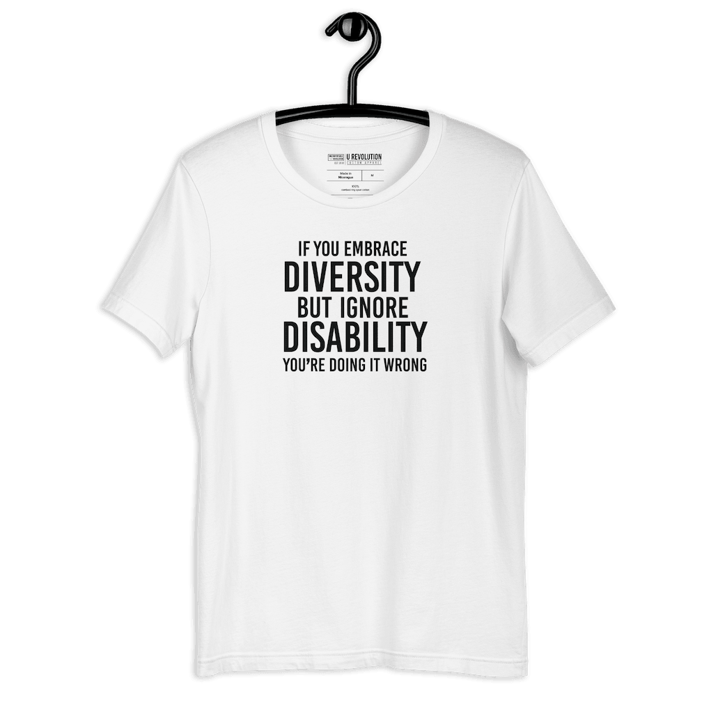 An image of a white Embrace Diversity T-Shirt. The t-shirt features the phrase, printed in white upper case letters, "If you embrace diversity but ignore disability, you're doing it wrong."