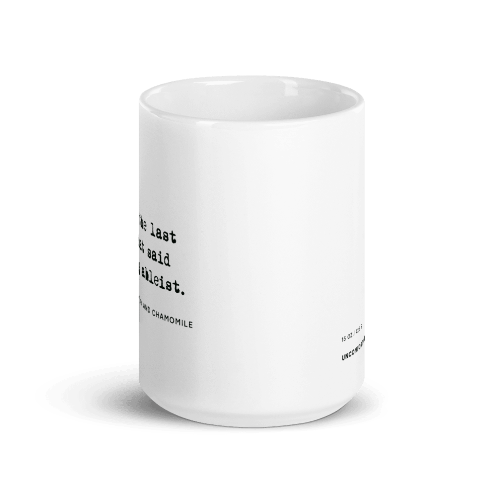 The ableist tears mug is white, with black text that reads: "no. 57. Tears of the last person that said something ableist. With hints of lemon and chamomile." 