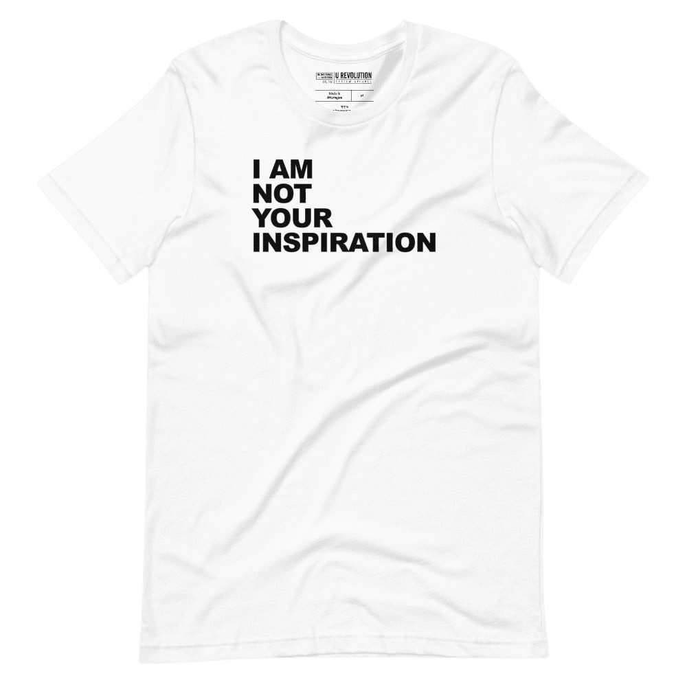 This is a white 'I Am Not Your Inspiration" t-shirt. On the top third of the inspiration shirt is the phrase, "I am not your inspiration," printed over four lines in black upper case letters.
