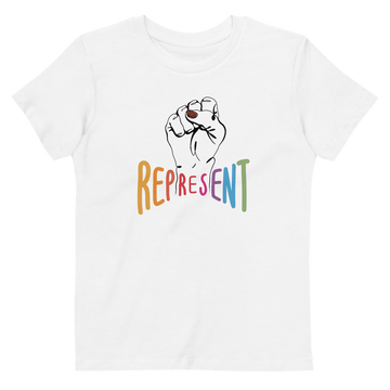 Photo of an organic kids white Represent tee. In the center of the organic tee is a black drawing of a raised clenched fist, with the handwritten word “represent,” written in upper case rainbow colors beneath the fist.