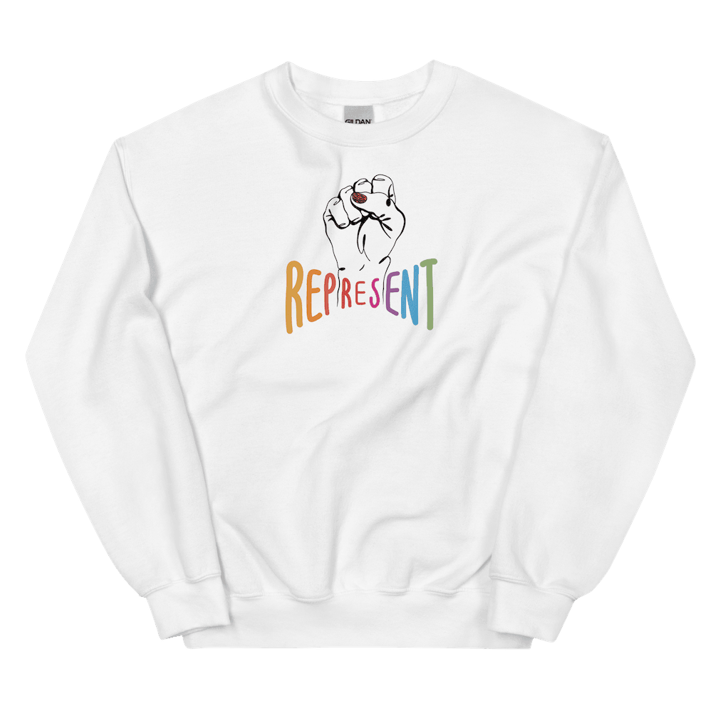 This is a photo of white represent sweatshirt. In the middle of the represent sweatshirt is a black line drawing of a raised clenched fist, with the handwritten word “represent,” written in upper case rainbow colors.