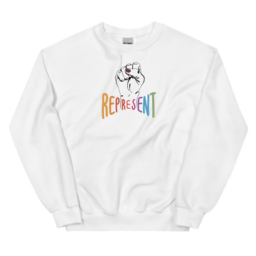 This is a photo of white represent sweatshirt. In the middle of the represent sweatshirt is a black line drawing of a raised clenched fist, with the handwritten word “represent,” written in upper case rainbow colors.