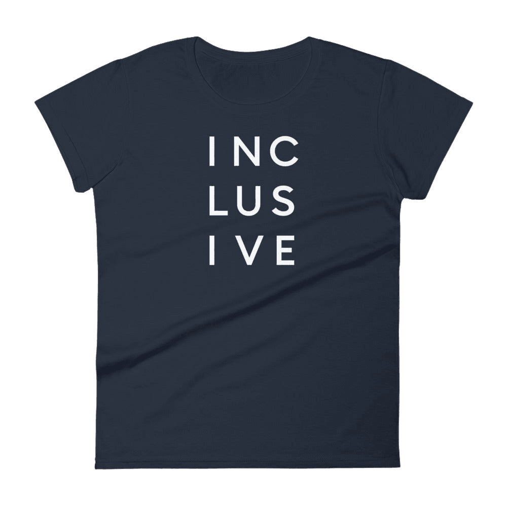 Navy women's cut inclusive t-shirt. It has the word 'inclusive' in the middle of the chest in upper case black letters over three lines, with three letters on each line: INC LUS IVE. The design takes up the top middle 1/3 of the front of the inclusive t-shirt.